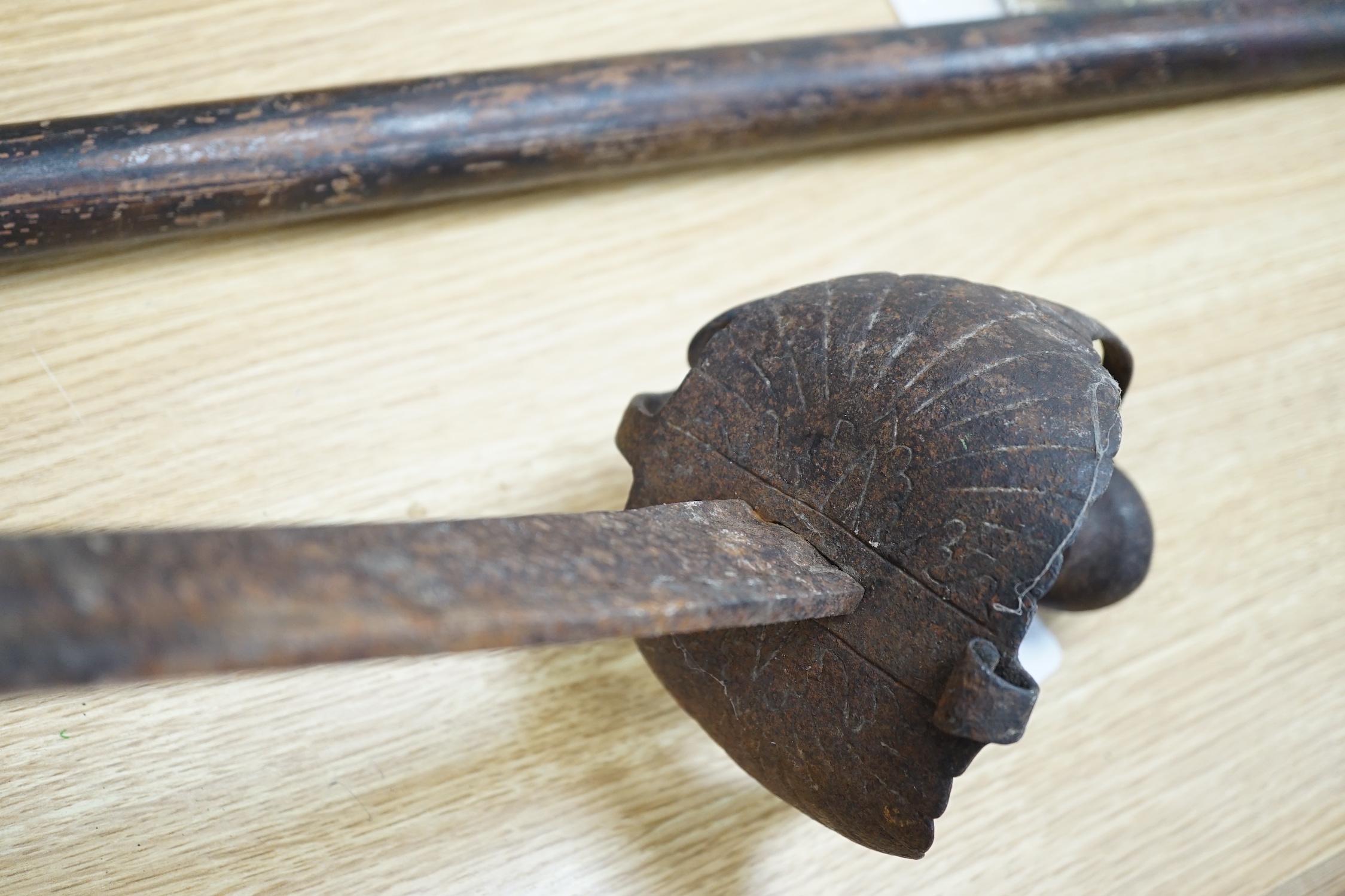 An early pike, a basket hilt sword and a French bayonet. longest 193cm